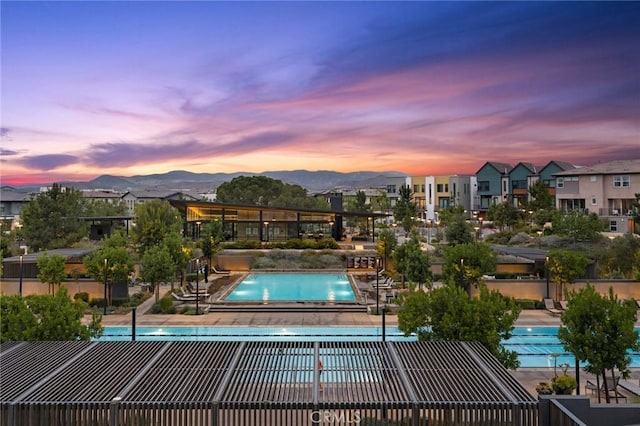 pool at dusk with a mountain view