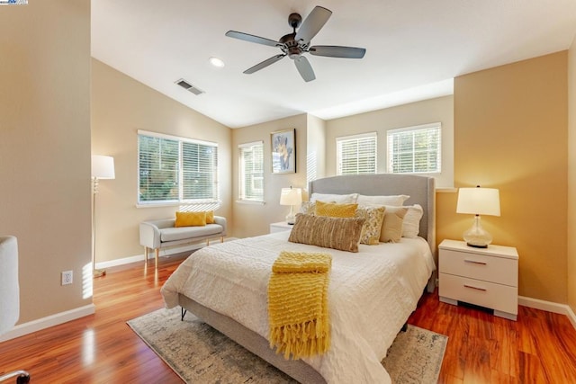 bedroom featuring lofted ceiling, ceiling fan, and hardwood / wood-style floors