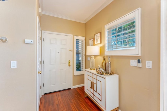 entrance foyer with hardwood / wood-style flooring and crown molding