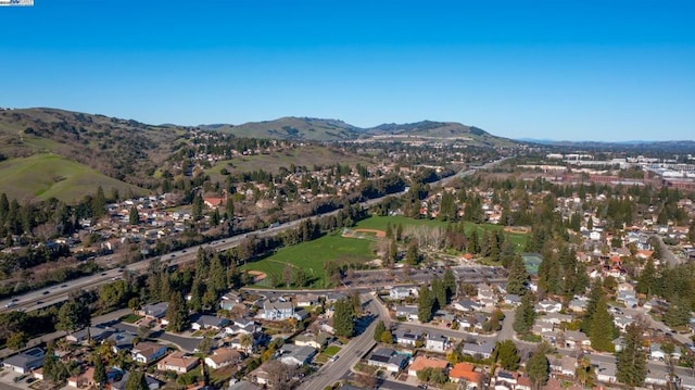 birds eye view of property with a mountain view