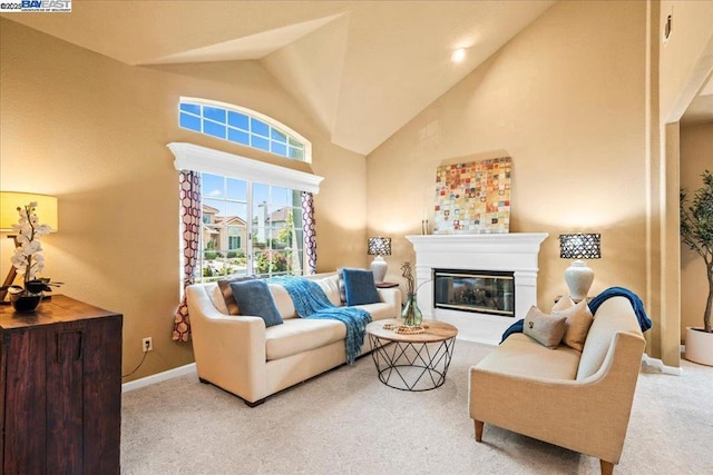 living room featuring vaulted ceiling and light carpet