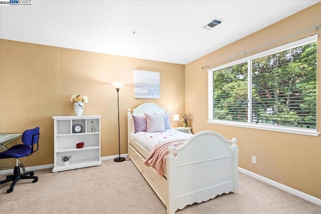 bedroom with light carpet