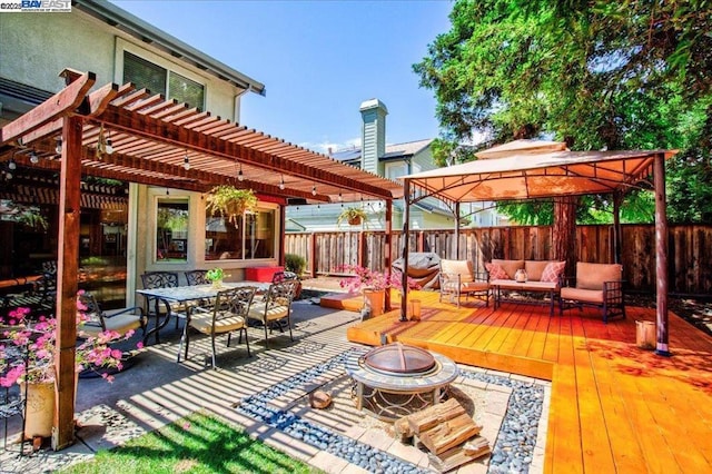 exterior space with a gazebo, an outdoor living space with a fire pit, and a pergola