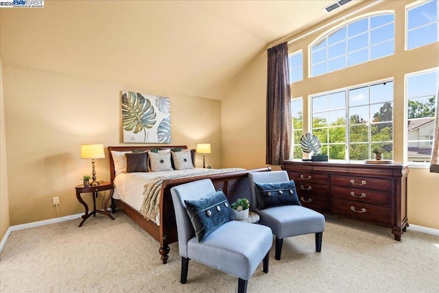 carpeted bedroom featuring lofted ceiling