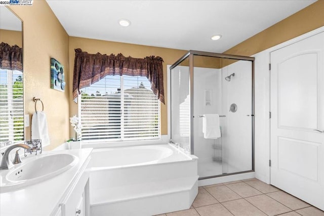 bathroom featuring vanity, tile patterned floors, plenty of natural light, and shower with separate bathtub