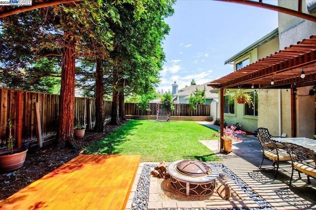 view of yard with an outdoor fire pit, a patio area, and a pergola