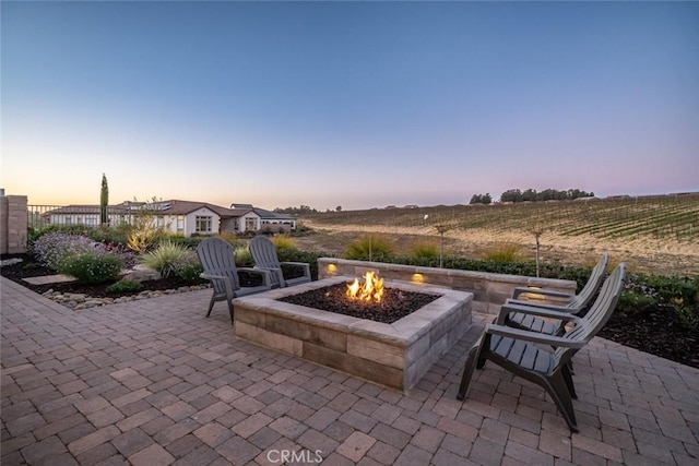 patio terrace at dusk with a fire pit