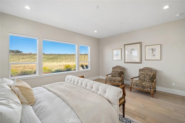 bedroom with light hardwood / wood-style flooring