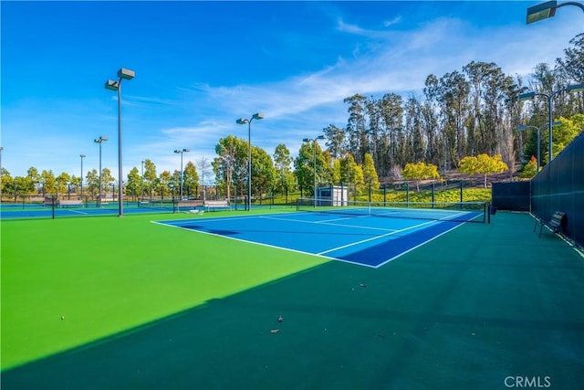 view of tennis court with basketball court