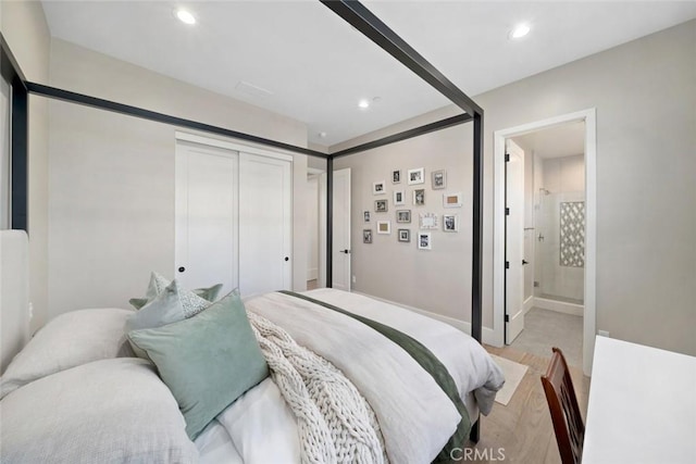 bedroom with a closet and ensuite bath