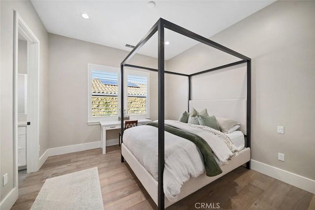 bedroom with light hardwood / wood-style flooring