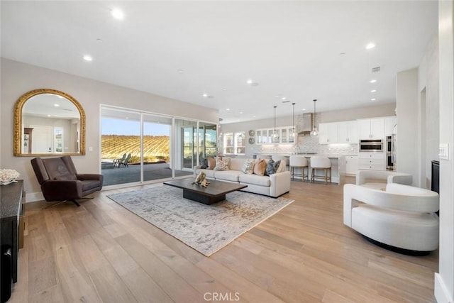 living room featuring light wood-type flooring