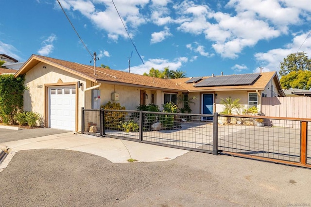 ranch-style house featuring a garage