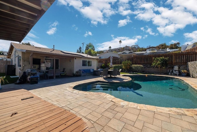 view of swimming pool featuring a patio area