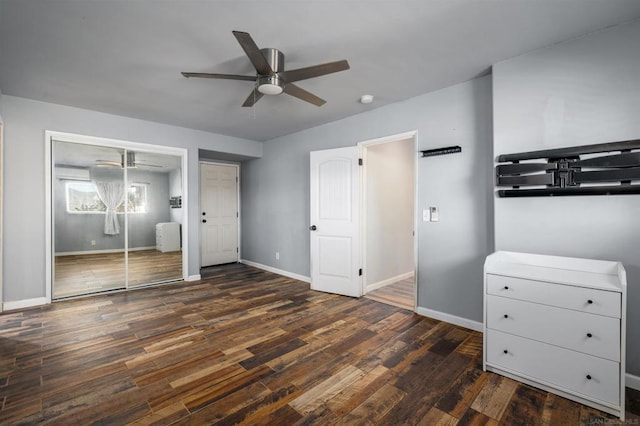 unfurnished bedroom with ceiling fan and dark hardwood / wood-style flooring