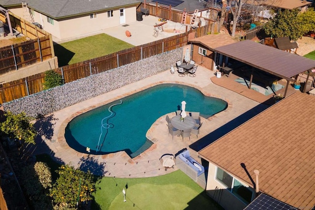 view of swimming pool with a patio area