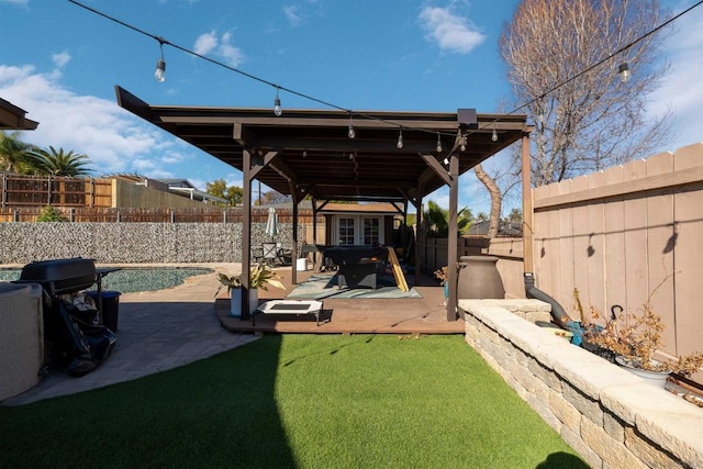 view of yard featuring a swimming pool, a patio, and an outdoor structure