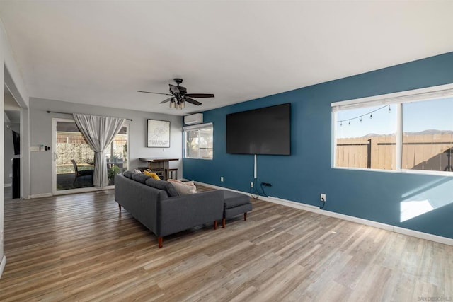 living room with hardwood / wood-style flooring and ceiling fan