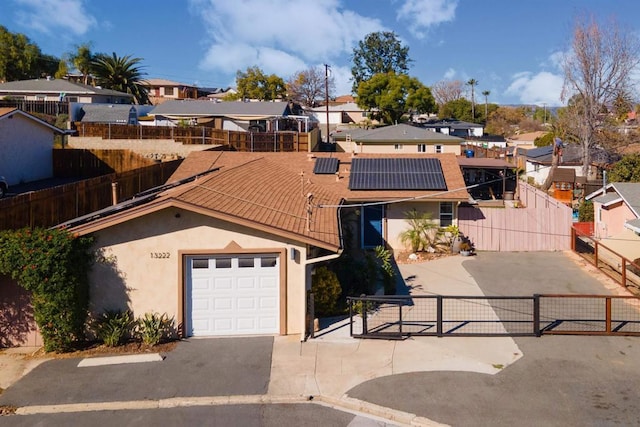 view of front of property with solar panels