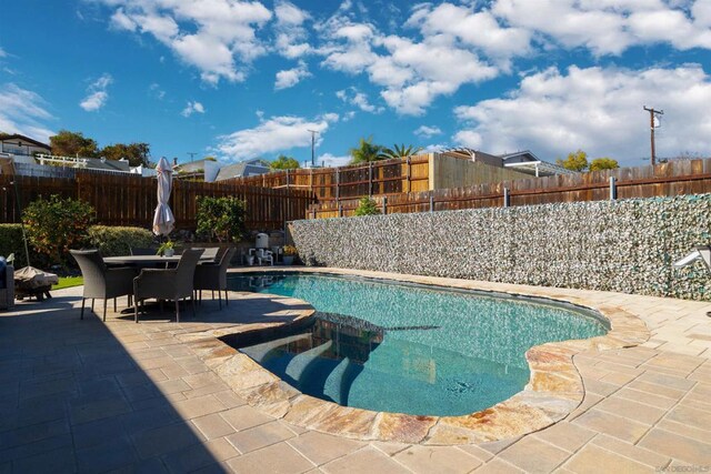 view of pool with a patio area