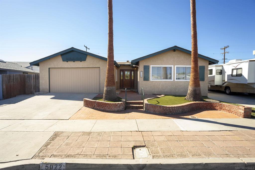 single story home with a garage