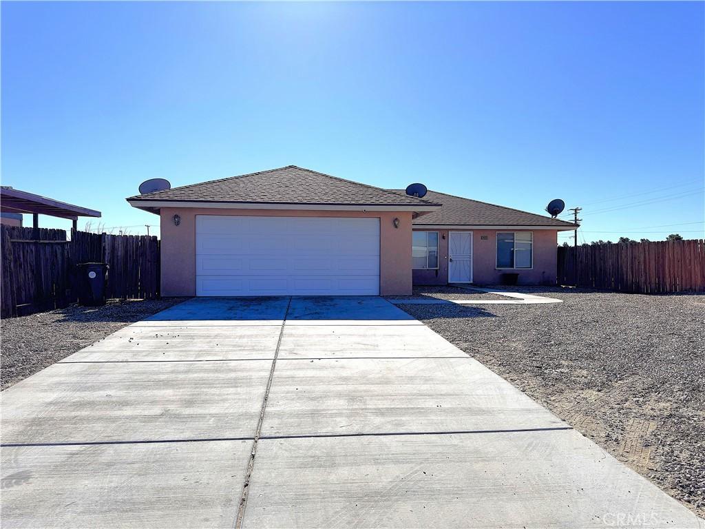 ranch-style house featuring a garage