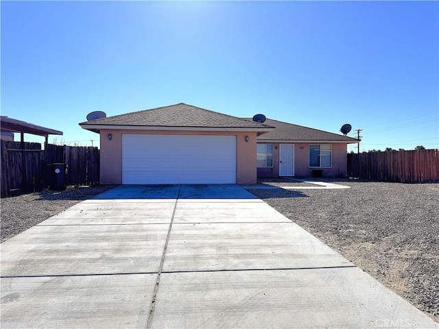 ranch-style house featuring a garage