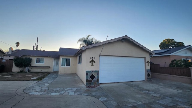 ranch-style home featuring a garage