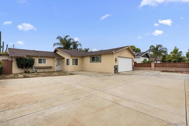 ranch-style home featuring a garage