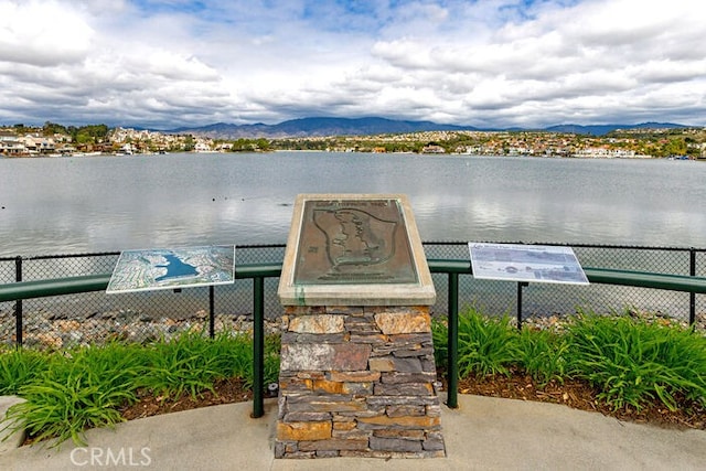 exterior space featuring a water and mountain view