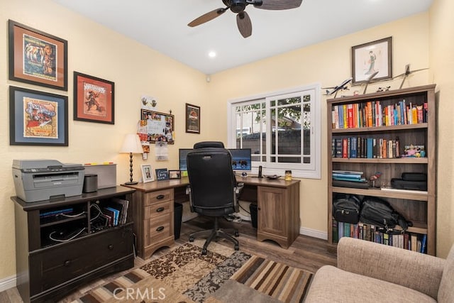 office with ceiling fan and dark hardwood / wood-style flooring