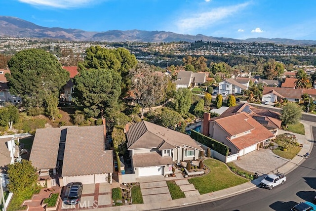 birds eye view of property with a mountain view