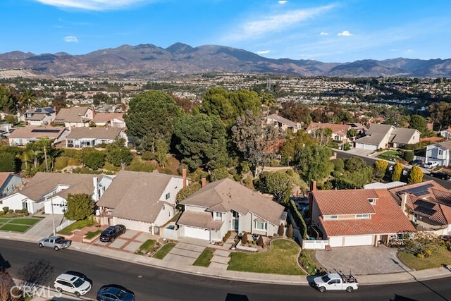 birds eye view of property featuring a mountain view