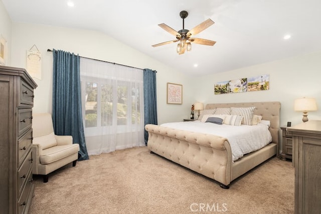 bedroom featuring ceiling fan, lofted ceiling, and light colored carpet