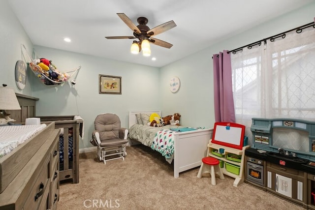 carpeted bedroom with ceiling fan