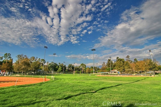 view of property's community with a lawn