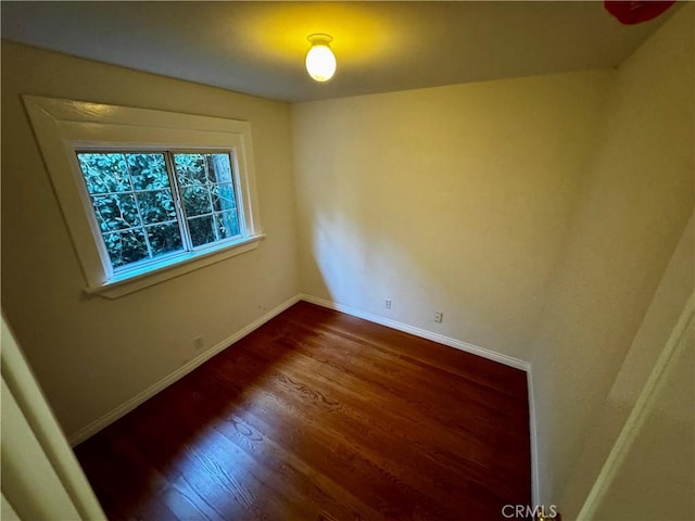 unfurnished room featuring dark hardwood / wood-style floors