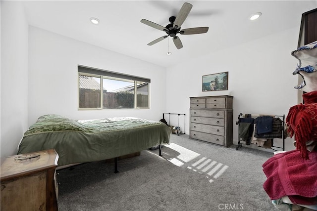 bedroom featuring ceiling fan and light carpet