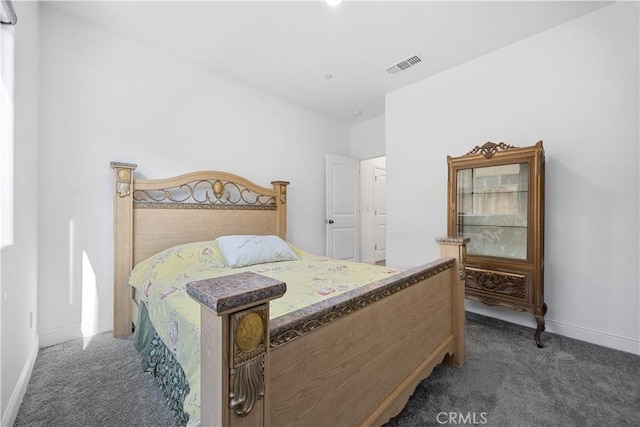 bedroom featuring dark carpet