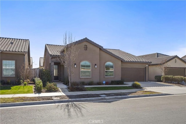 mediterranean / spanish-style home featuring a garage