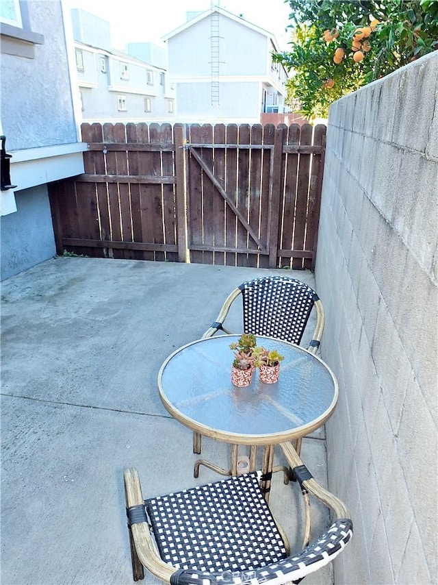 view of patio featuring fence