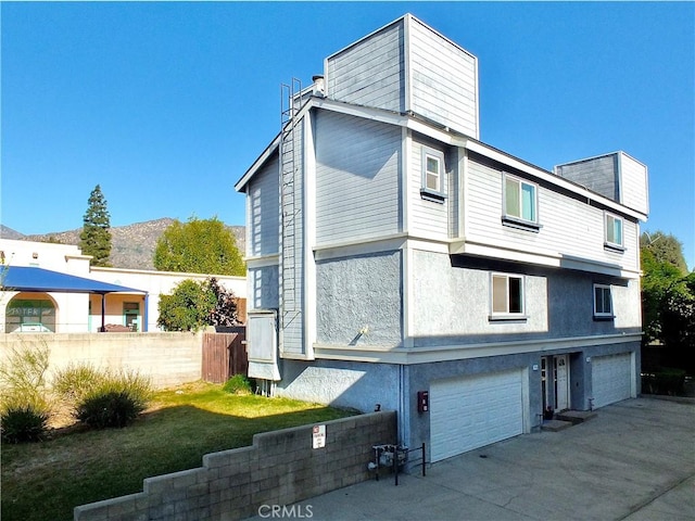 rear view of house with a garage