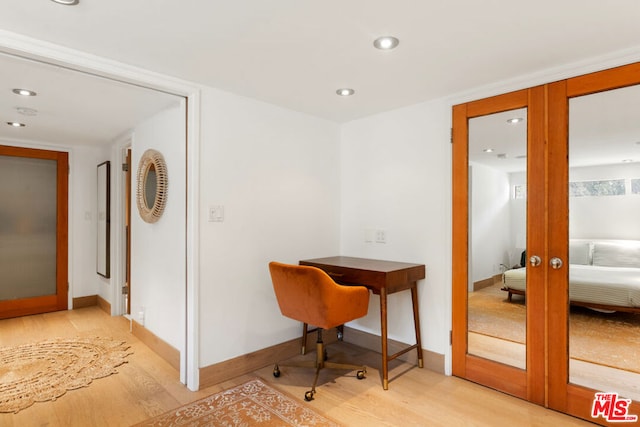 office area featuring french doors and hardwood / wood-style floors