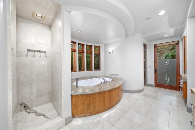 bathroom featuring plus walk in shower and tile patterned floors