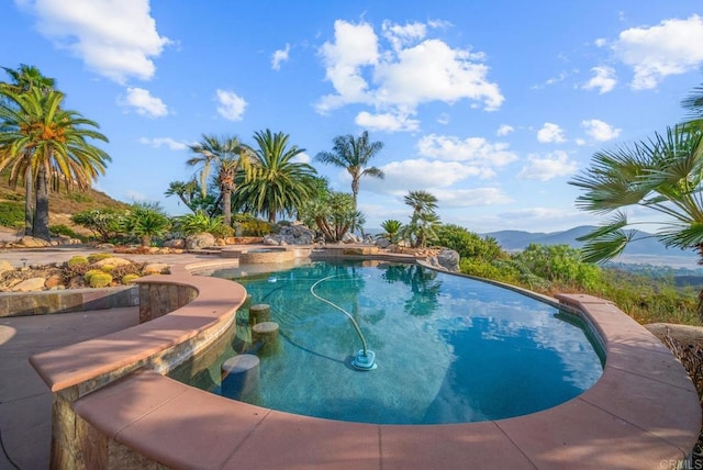 view of swimming pool featuring a mountain view