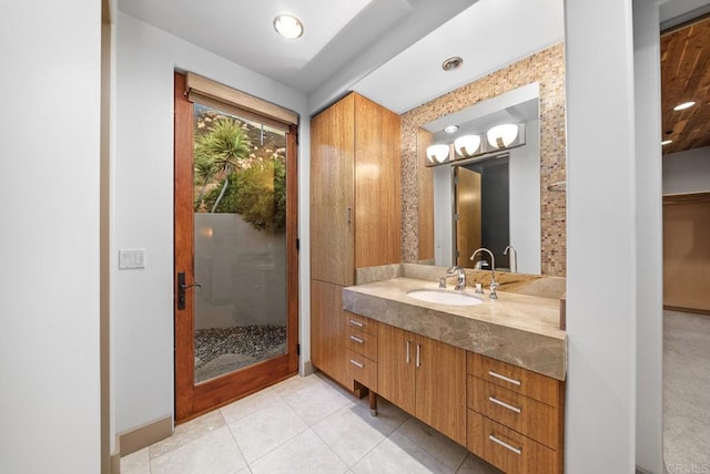 bathroom with tile patterned flooring and vanity