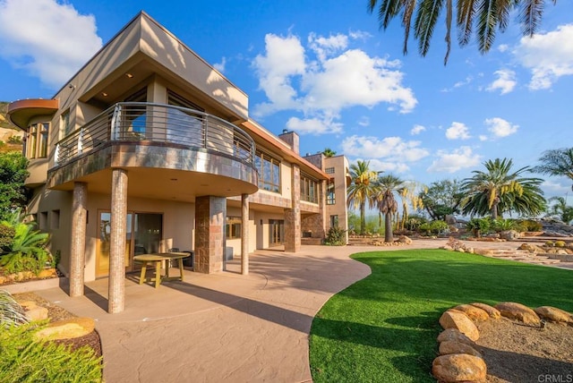 exterior space featuring a patio and a yard