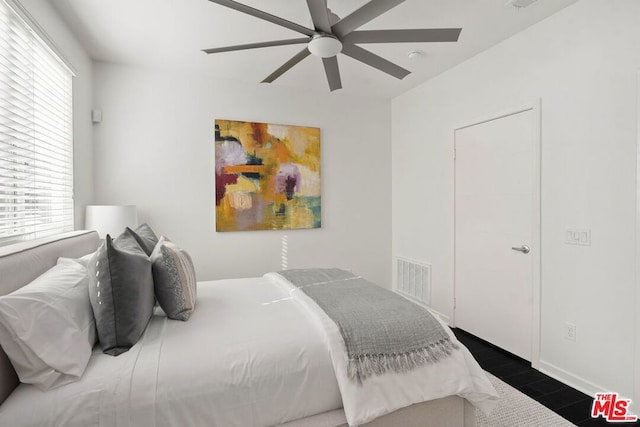 bedroom featuring dark wood-type flooring and ceiling fan