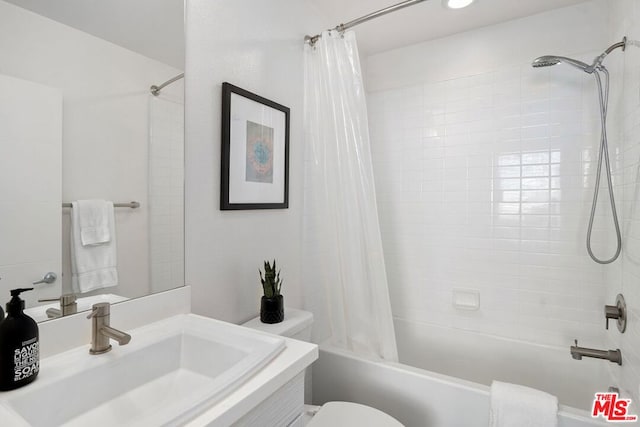 full bathroom with toilet, shower / tub combo, and sink