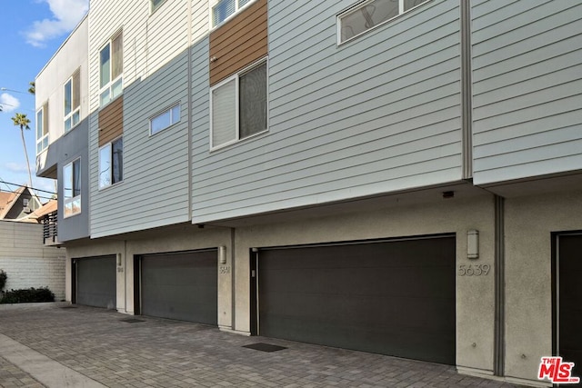 view of side of home with a garage